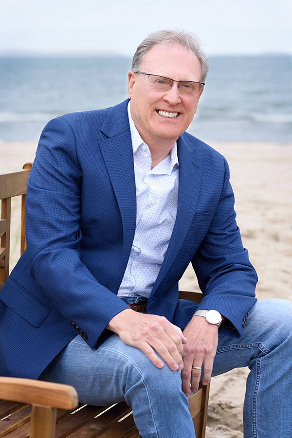 Jim sitting on bench at beach 6.6.23 FINAL