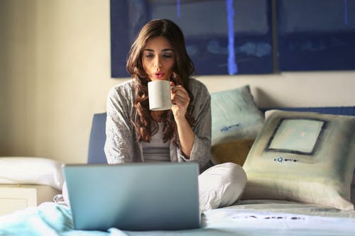 Lady Drinking Coffee in Bed, writing