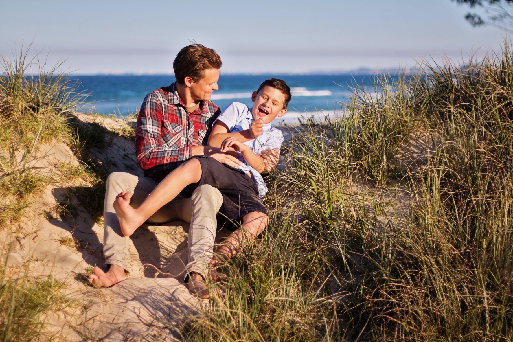 Father and son on beach